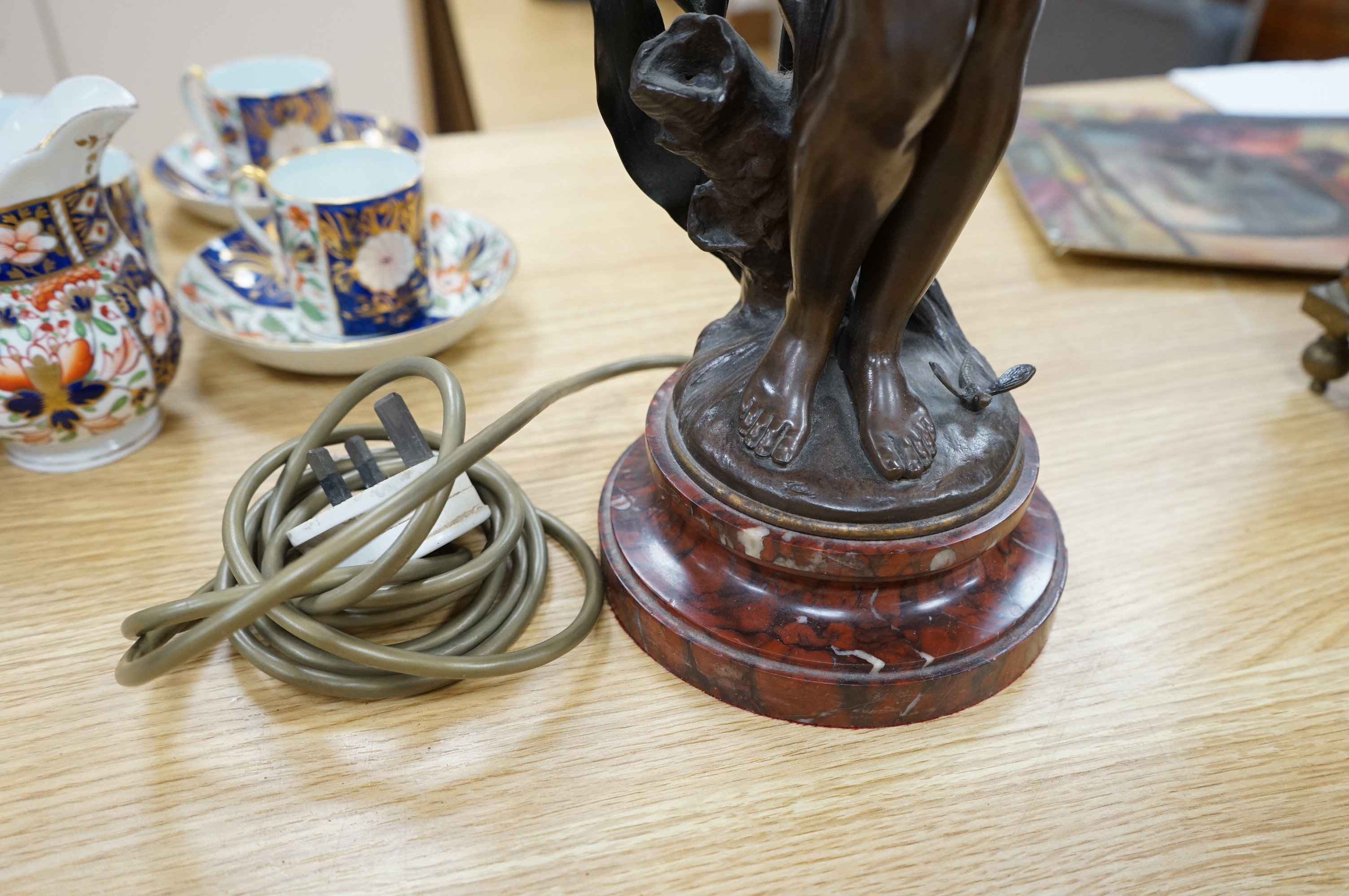 Auguste Moreau, a bronze figure of a nymph on a rouge marble base, later converted to a table lamp, 64cm high., Condition - good